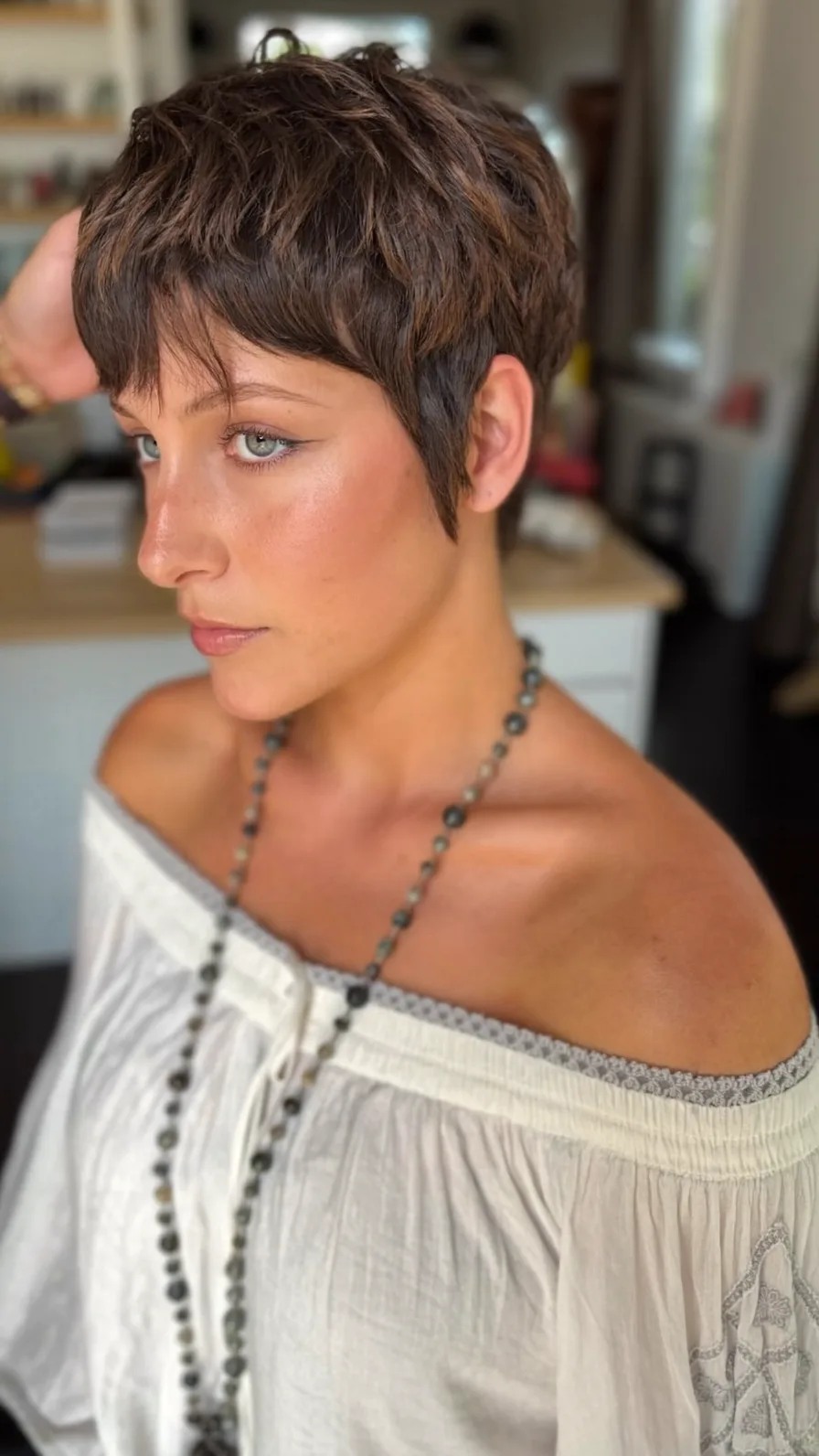 Modern Textured Pixie Cut with Warm Caramel Highlights