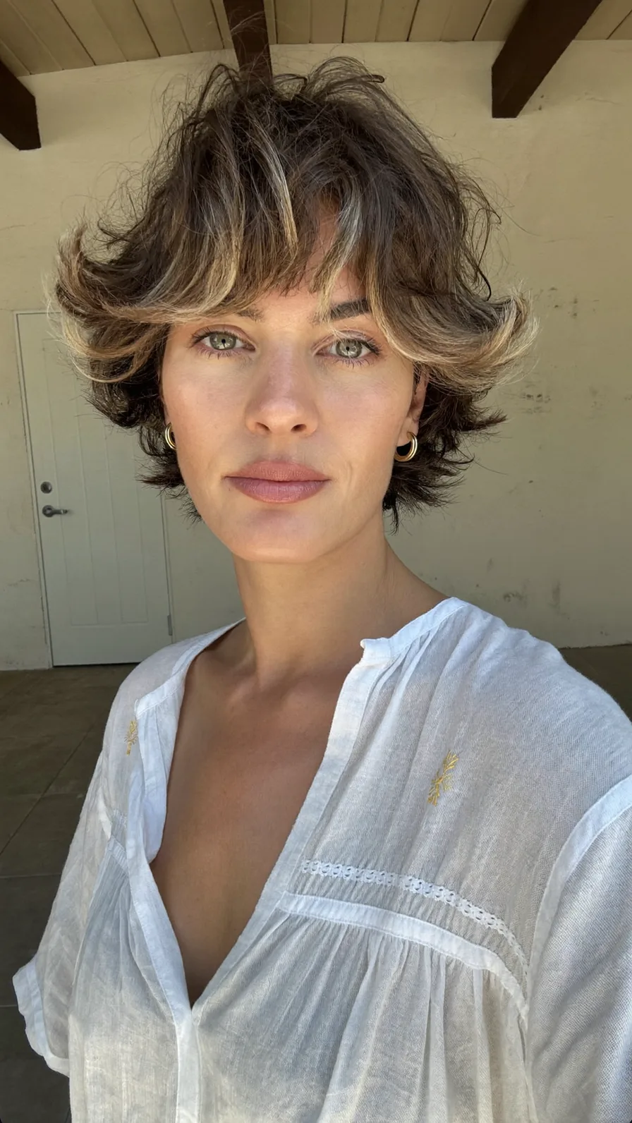 Modern Shag with Curtain Bangs and Cool Blonde Balayage