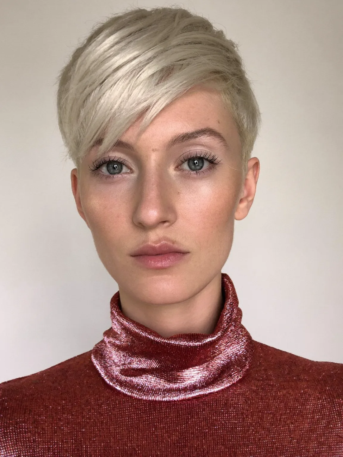 Platinum Blonde Pixie with Side-Swept Straight Layers