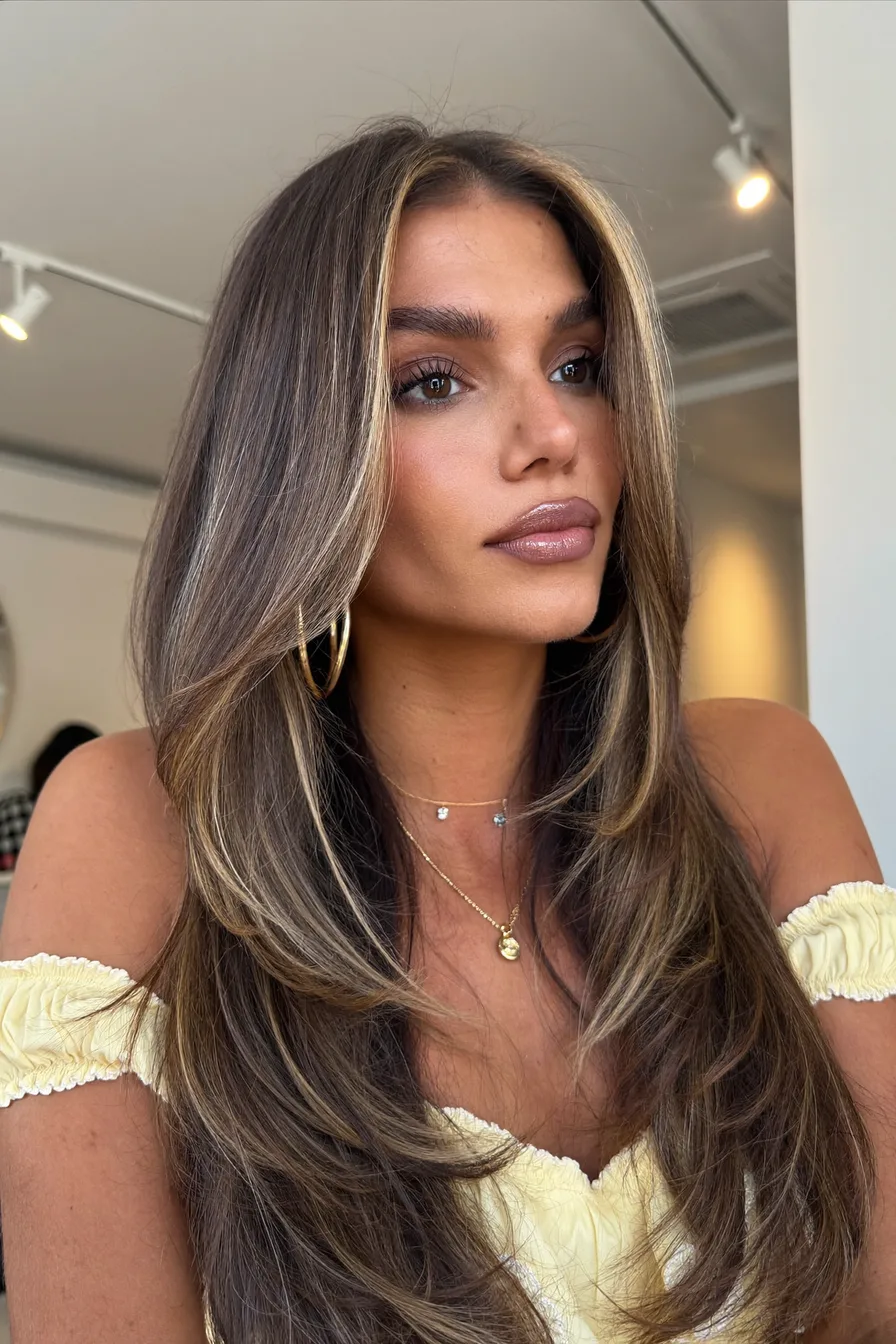 Voluminous Balayage Brunette Wavy Long Layered Hair with Face-Framing Highlights