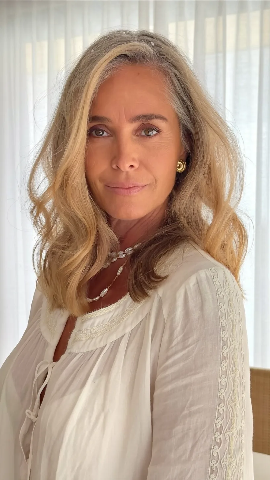 Soft Layered Medium-Length Honey Blonde Wavy Hairstyle