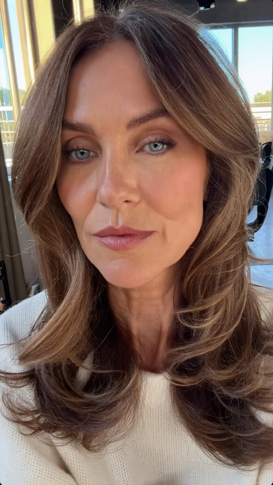 Voluminous Medium-Length Warm Brown Long Layers with Curtain Bangs