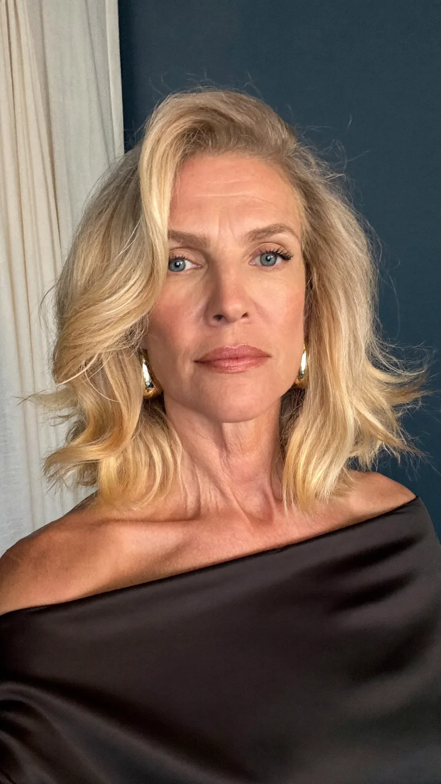 Soft Wavy Shoulder-Length Blonde with Side-Swept Layers