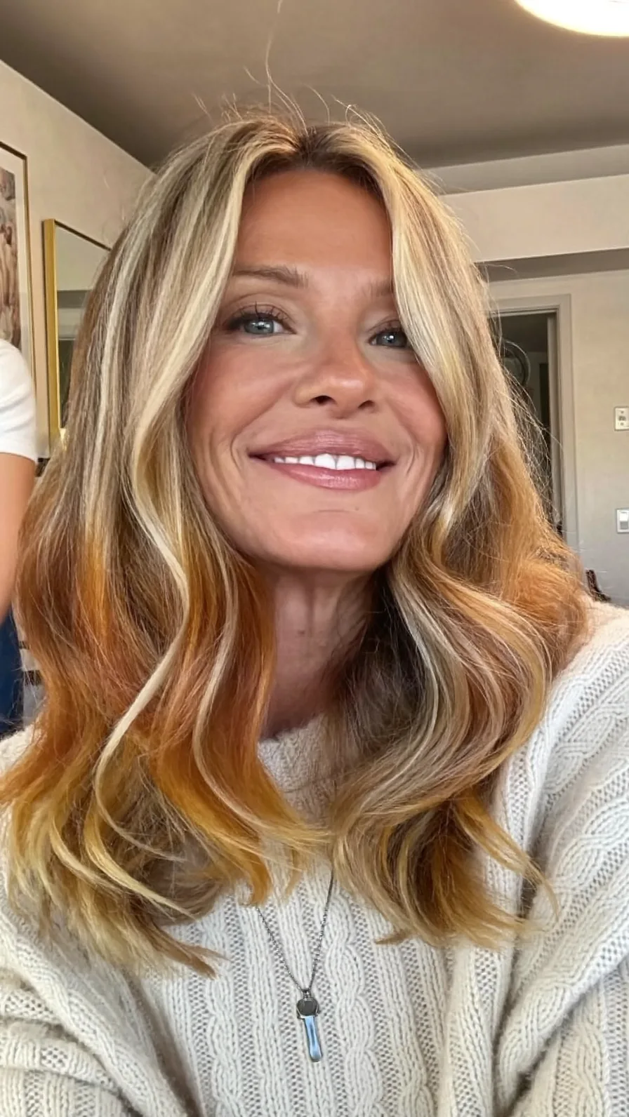 Voluminous Medium-Length Honey Blonde Hair with Curtain Bangs