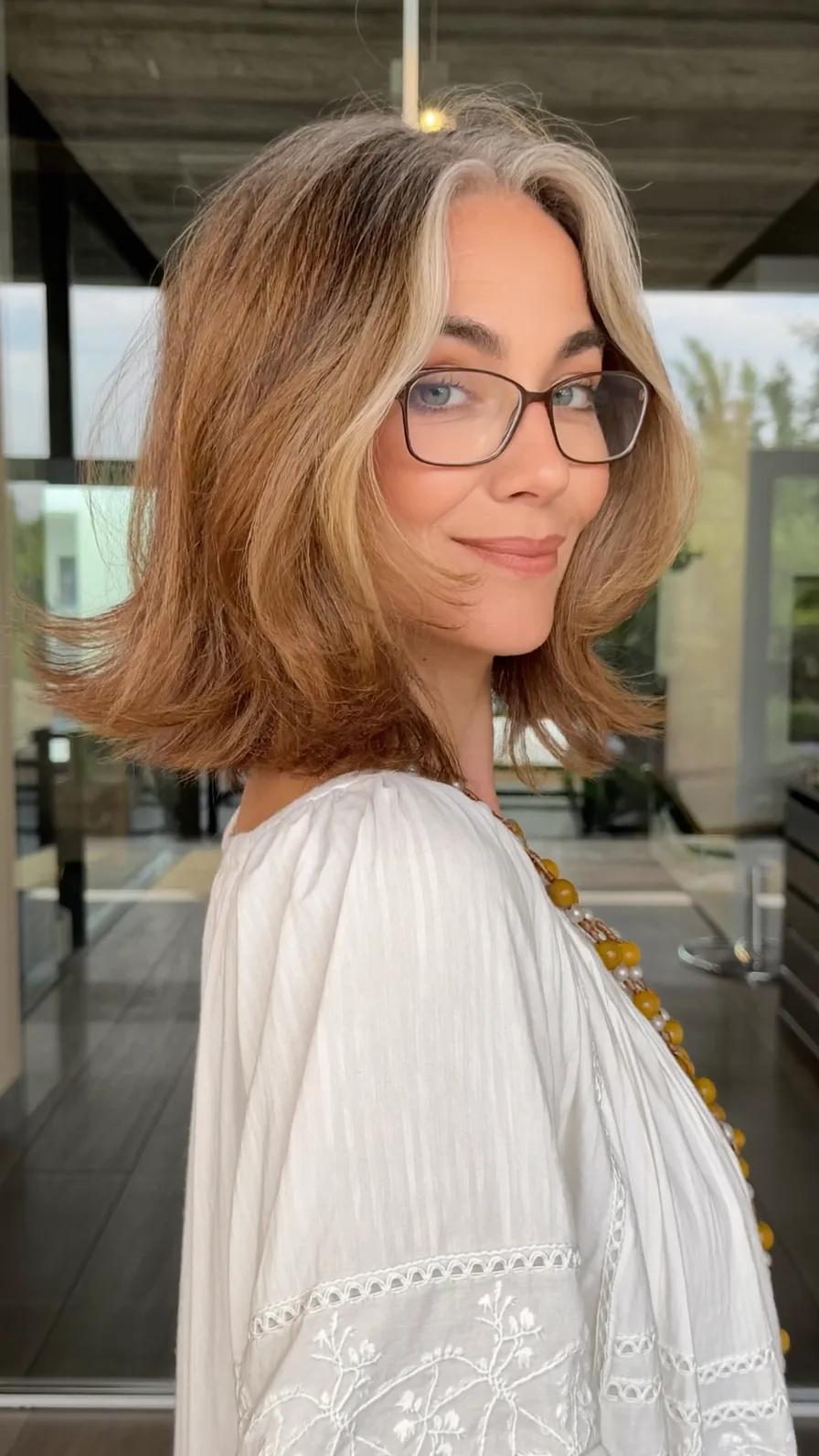 Elegant Shoulder-Length Layered Hair with Curtain Bangs