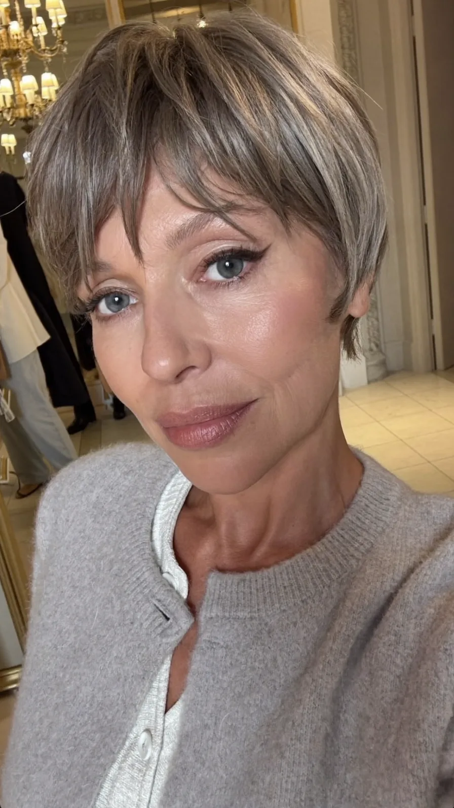Elegant Textured Ash Brown Pixie Cut with Side-Swept Bangs