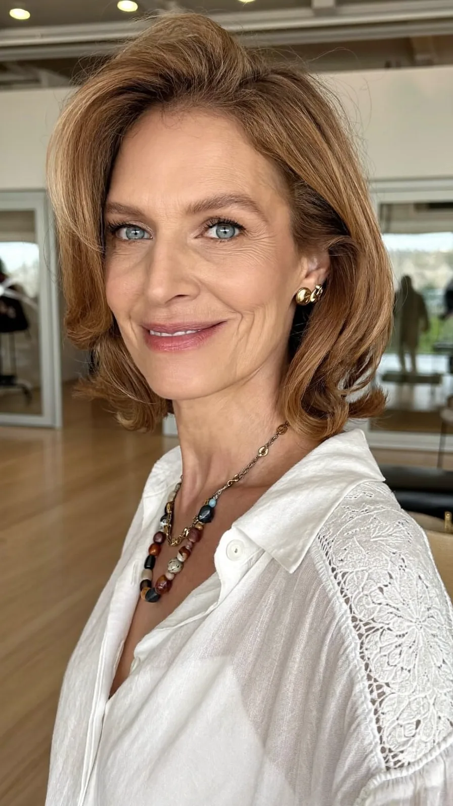 Voluminous Layered Shoulder-Length Hairstyle with Side-Swept Bangs