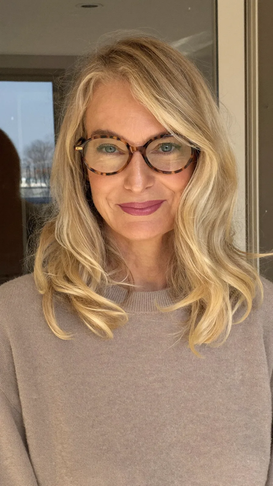 Elegant Warm Honey Blonde Medium-Length Layers with Side-Swept Bangs