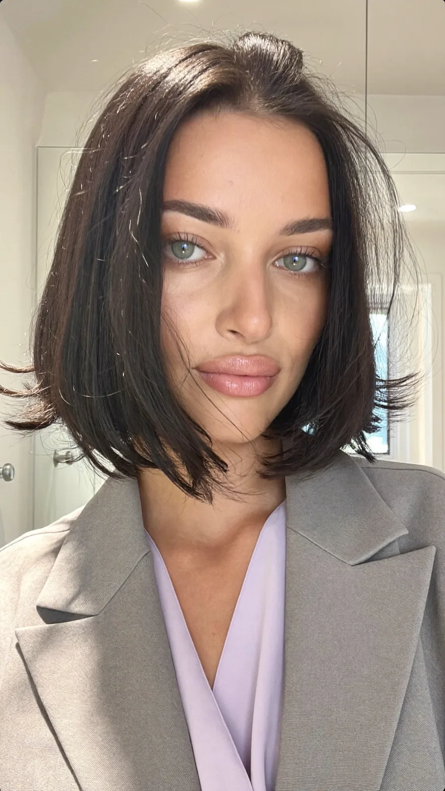 Sleek Chin-Length Blunt Bob with Flicked Ends