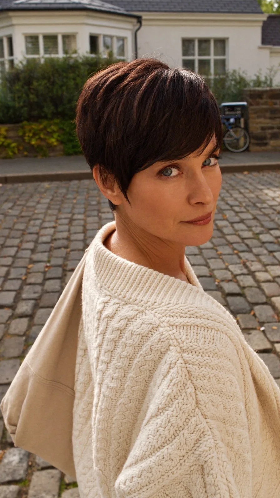 Sophisticated Layered Pixie Cut with Side-Swept Bangs