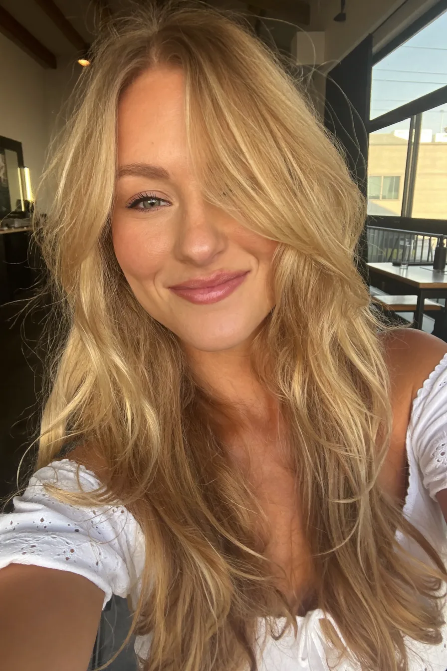 Textured Long Layered Haircut with Soft Side-Swept Bangs for Effortless Volume