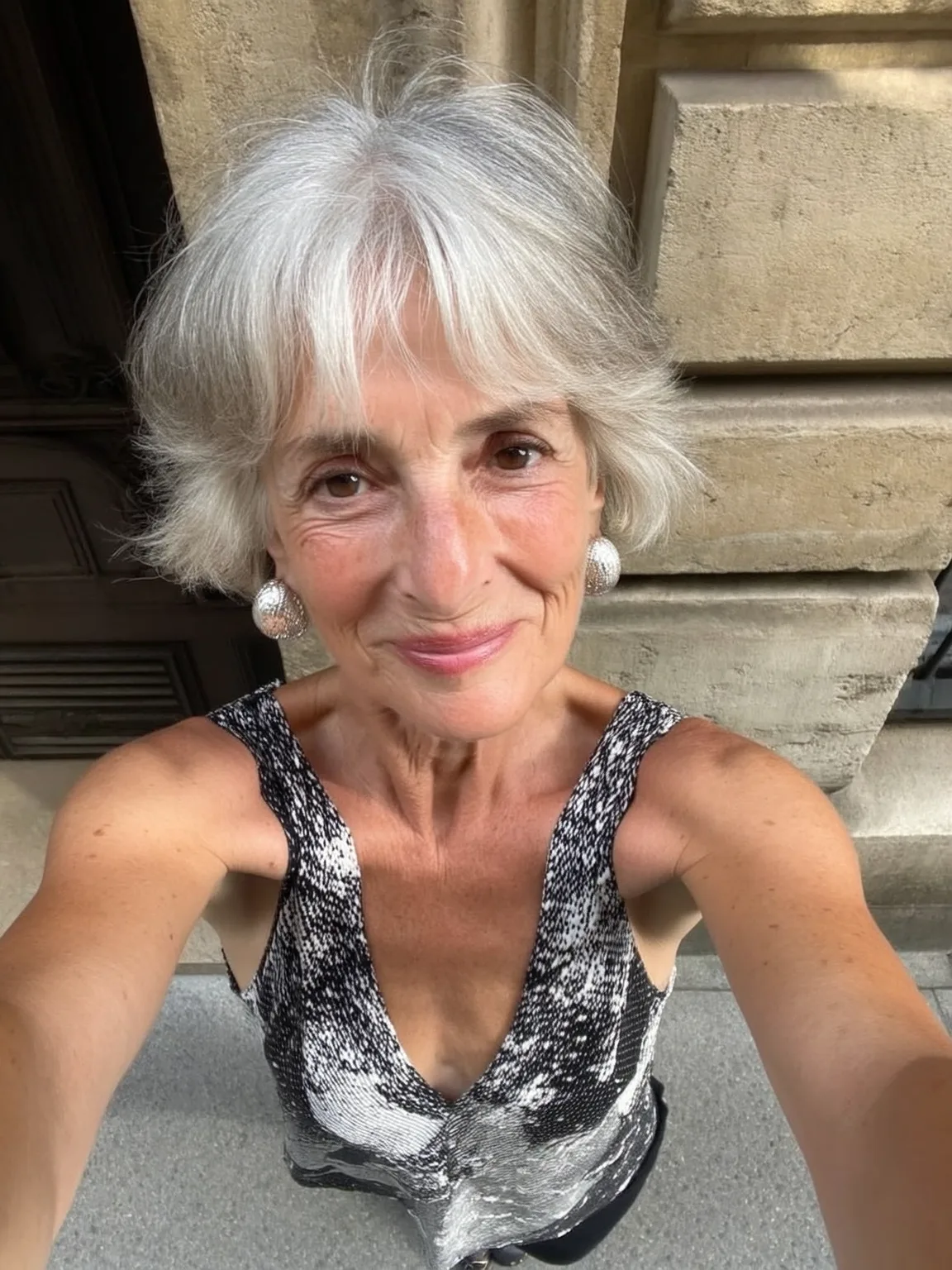 Sleek Short Silver Frost Feathered Hairstyle with Wispy Bangs