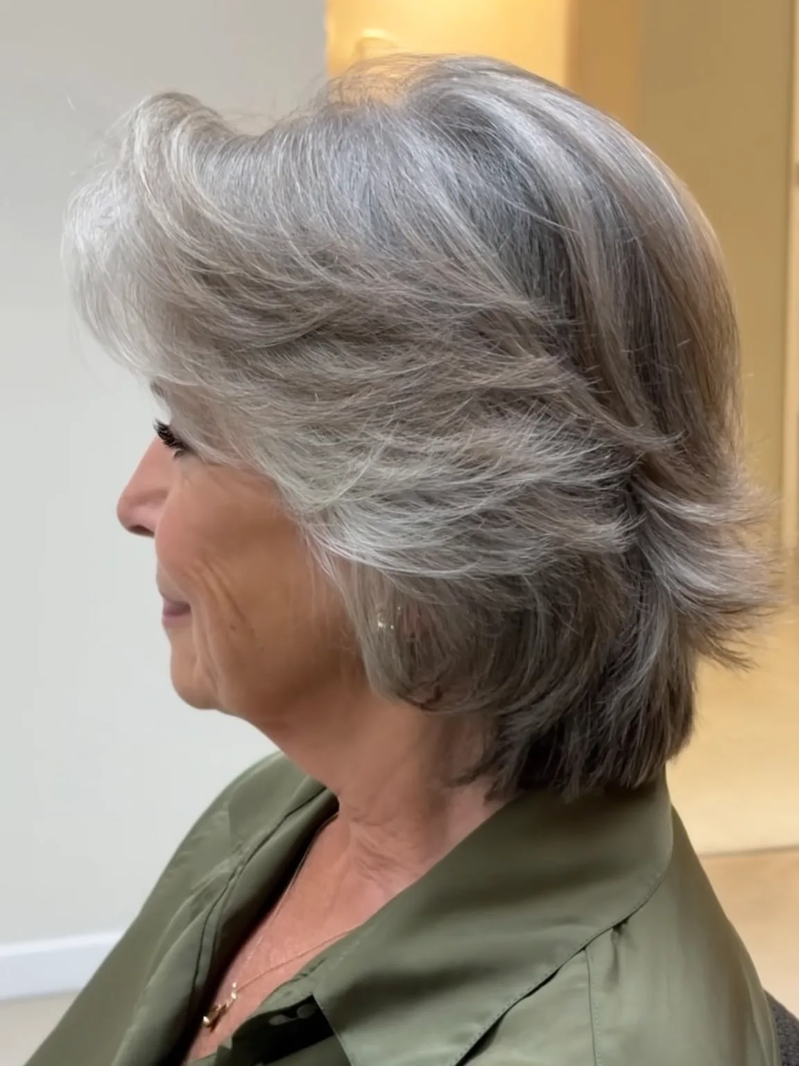 Medium-Length Wavy Silver Frost with Side-Swept Bangs