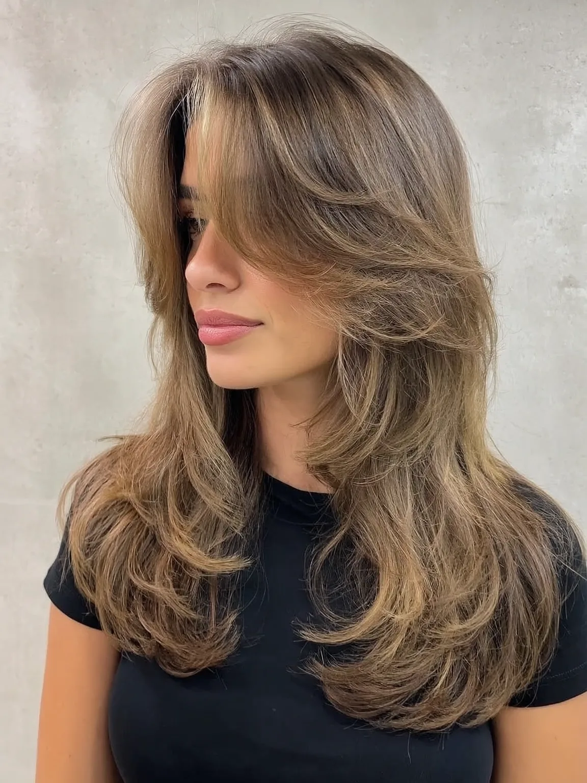 Long Voluminous Sandy Blonde Layers with Long Bangs