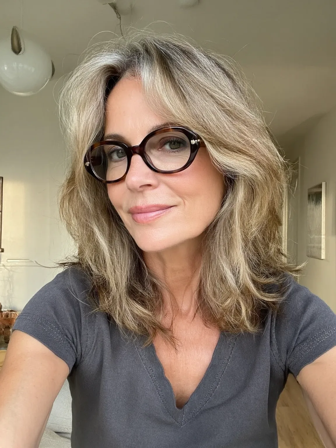 Layered Shoulder-Length Cut in Sandy Blonde Waves