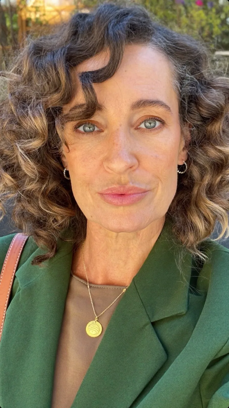 Voluminous Layered Curly Bob with Warm Caramel Balayage Highlights
