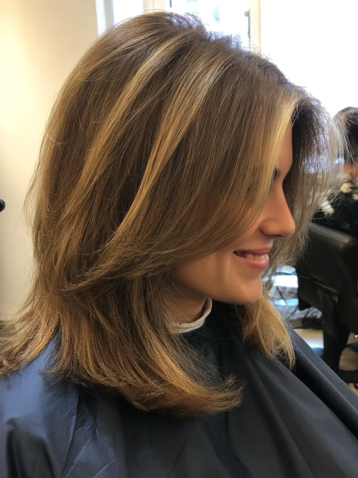 Shoulder-Length Lob with Sandy Blonde Highlights