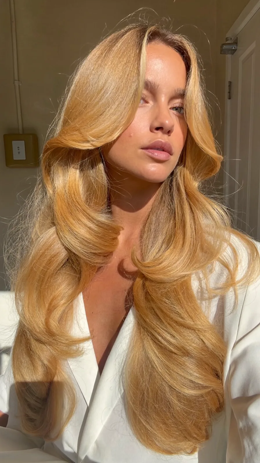 Classic Long Blonde Layers with Flowing Flicked Ends