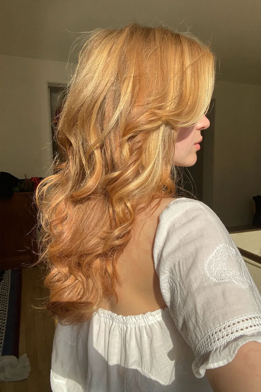 Flowing Long Layered Warm Golden Blonde Hairstyle
