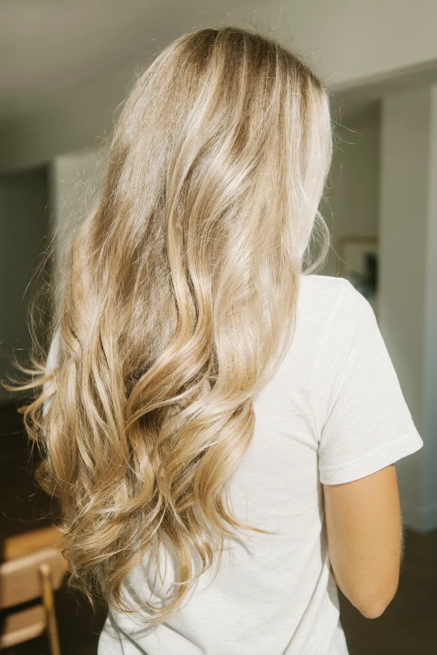 Long Layered Waves with Multi-Dimensional Blonde Balayage