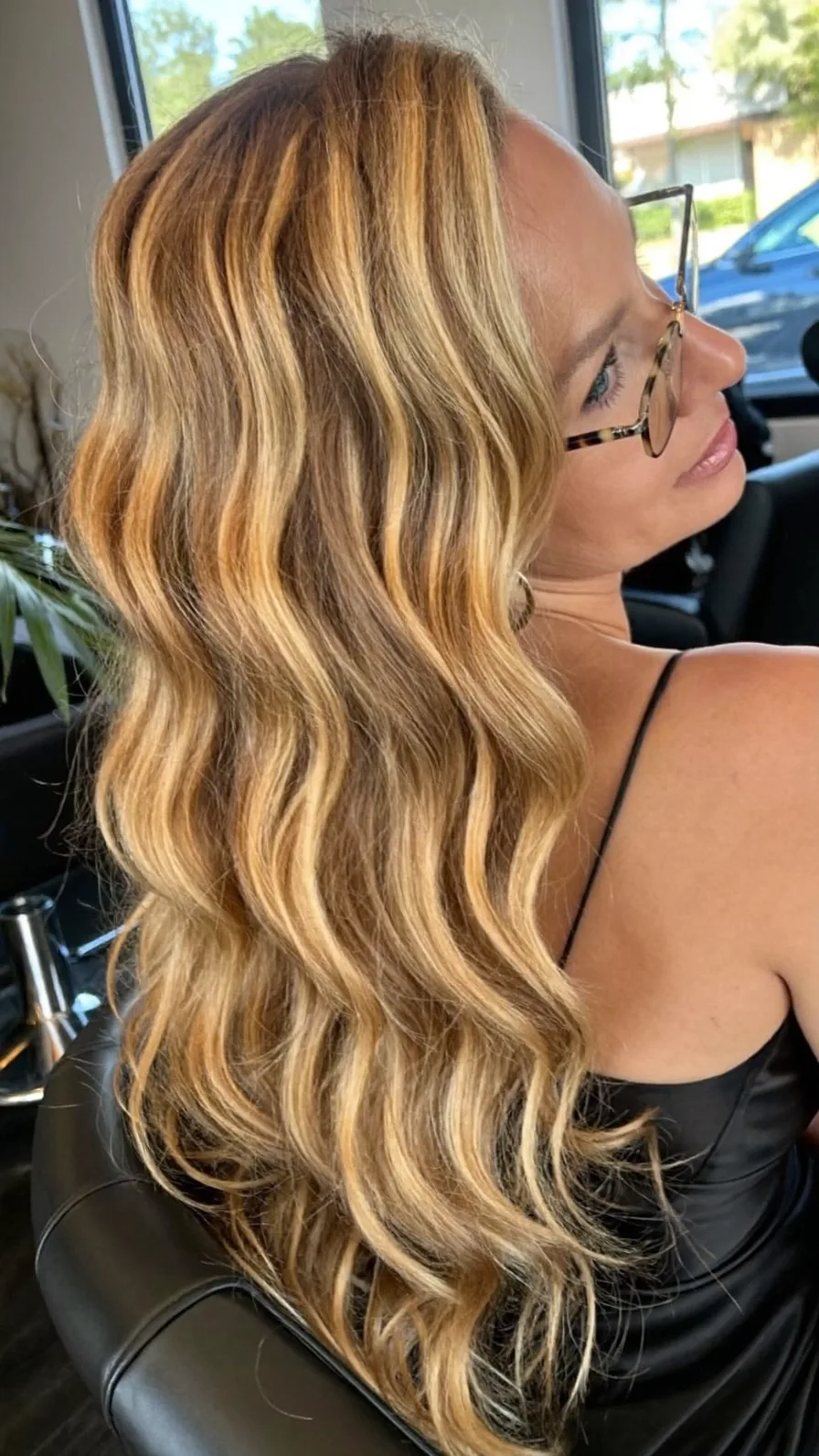 Voluminous Warm Blonde Wavy Long Layers with Side Part