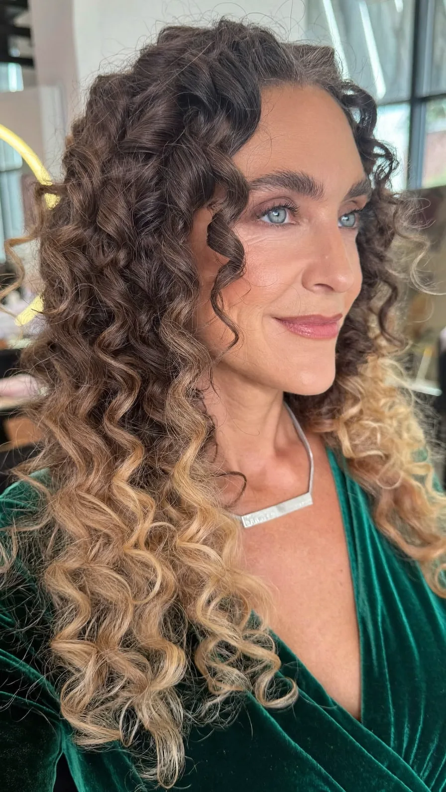 Voluminous Long Curly Layers with Golden Blonde Balayage Highlights