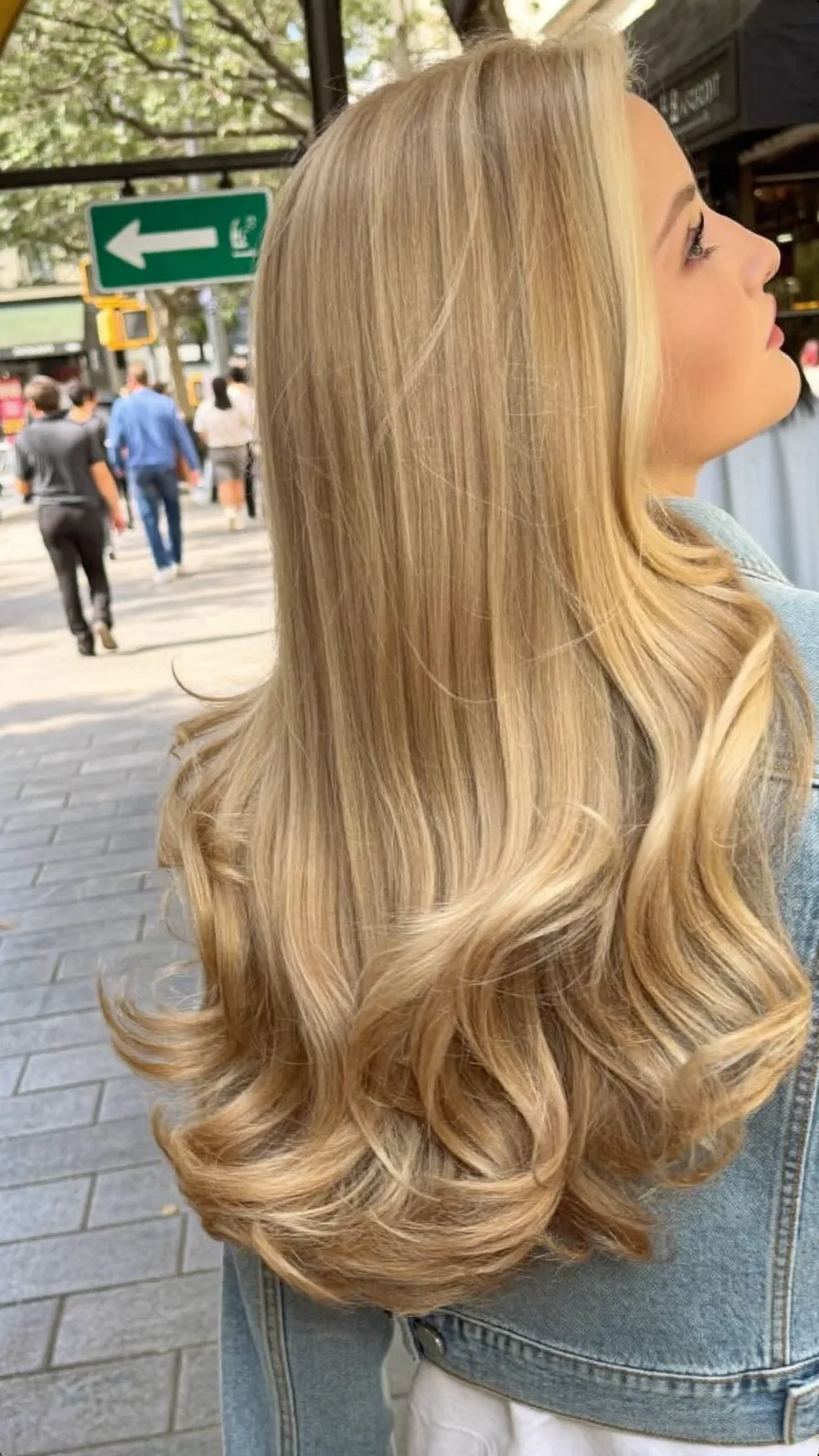 Golden Blonde Long Layered Hair with Soft Flicked Ends