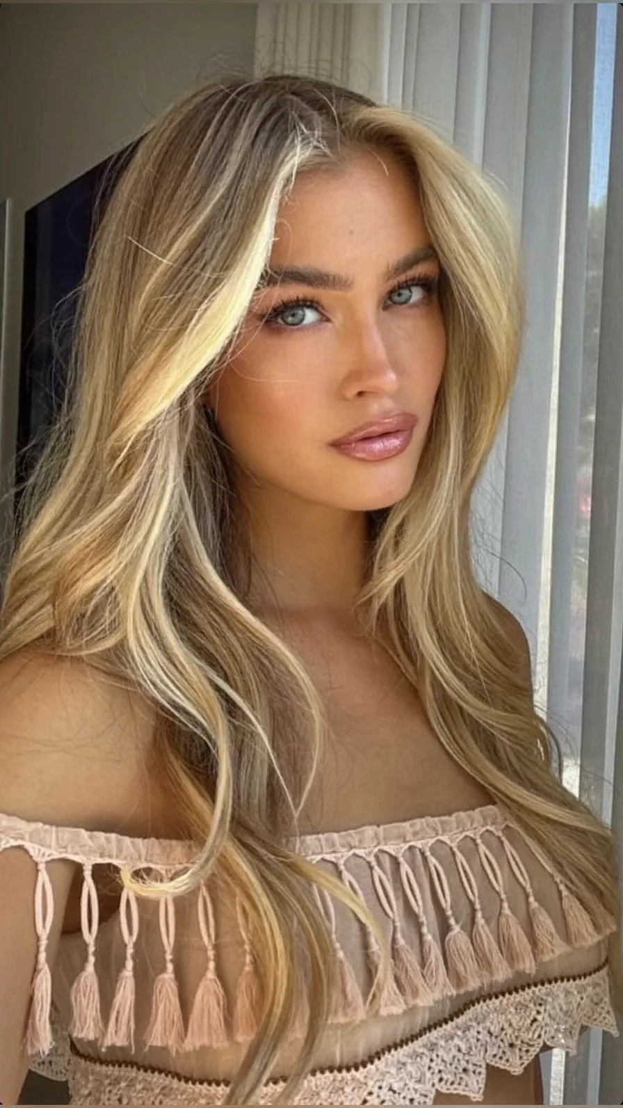 Golden Blonde Long Layers with Sun-Kissed Balayage Waves