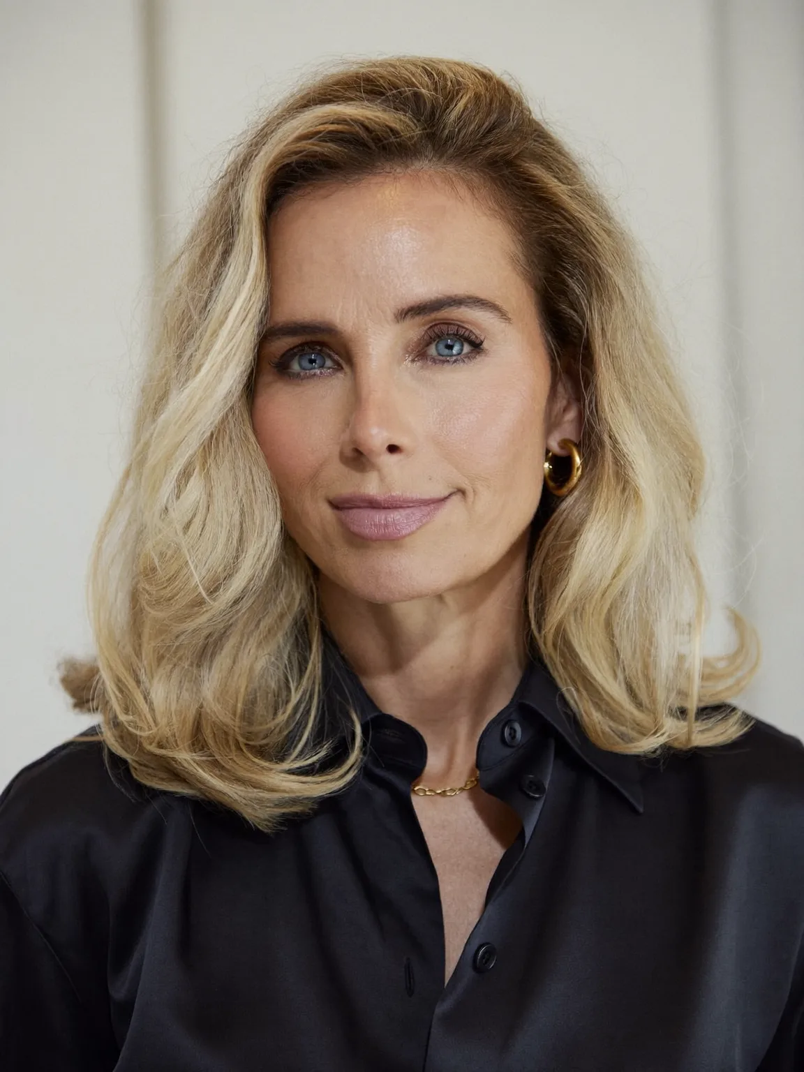 Voluminous Wavy Golden Blonde Lob with Side-Swept Bangs