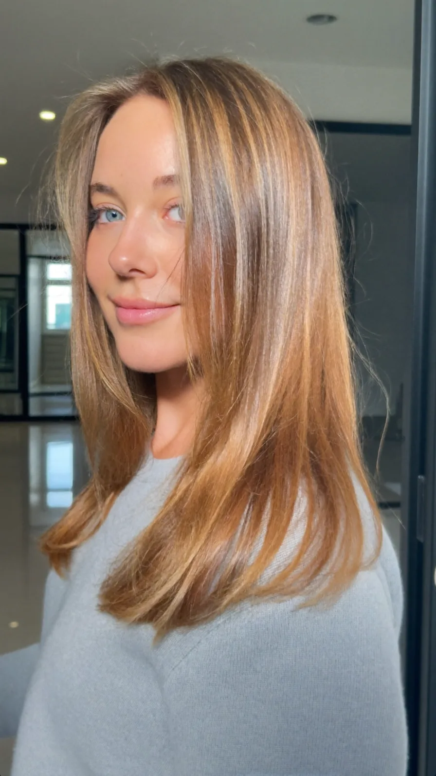 Classic Medium Length Hair with Curtain Bangs and Balayage Highlights