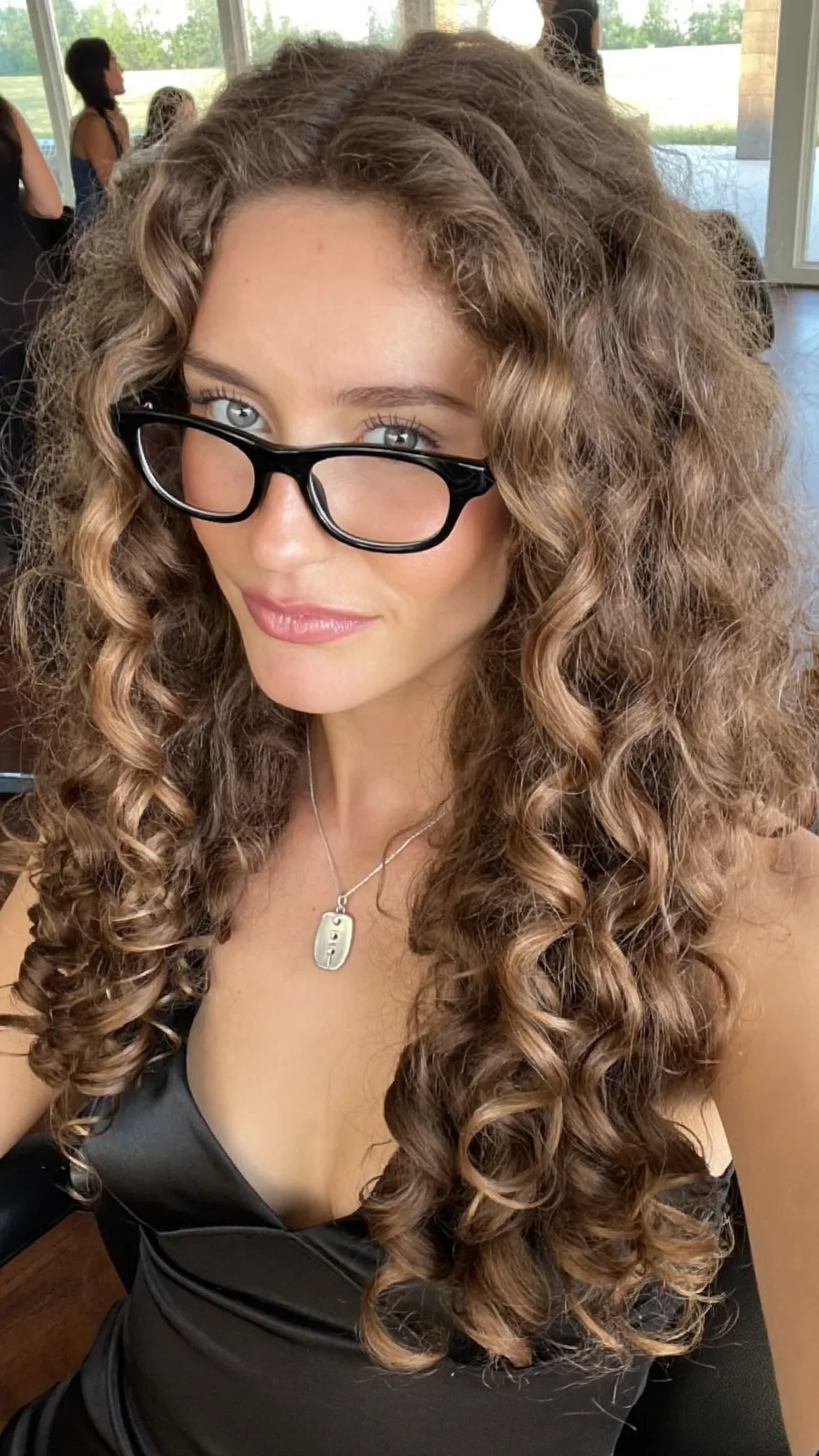 Long Voluminous Curly Hair with Warm Caramel Balayage Highlights