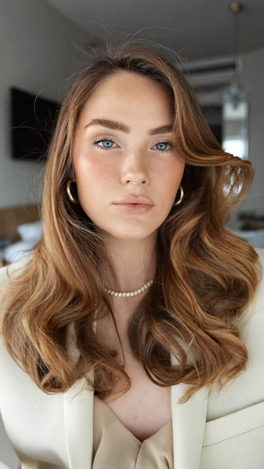Elegant Shoulder-Length Warm Brown Waves with Side-Swept Layers