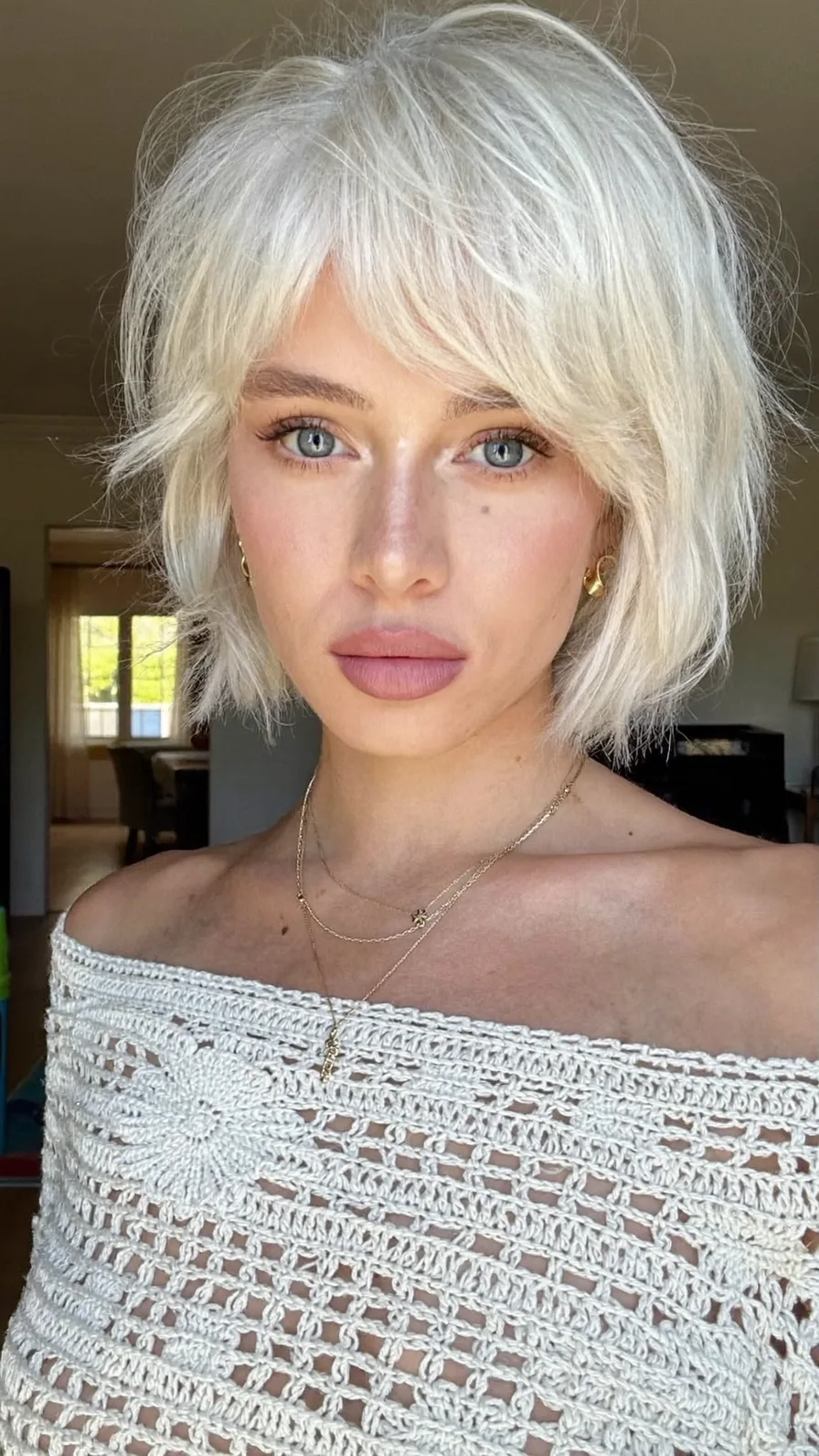 Textured Platinum Blonde Shag with Side-Swept Bangs
