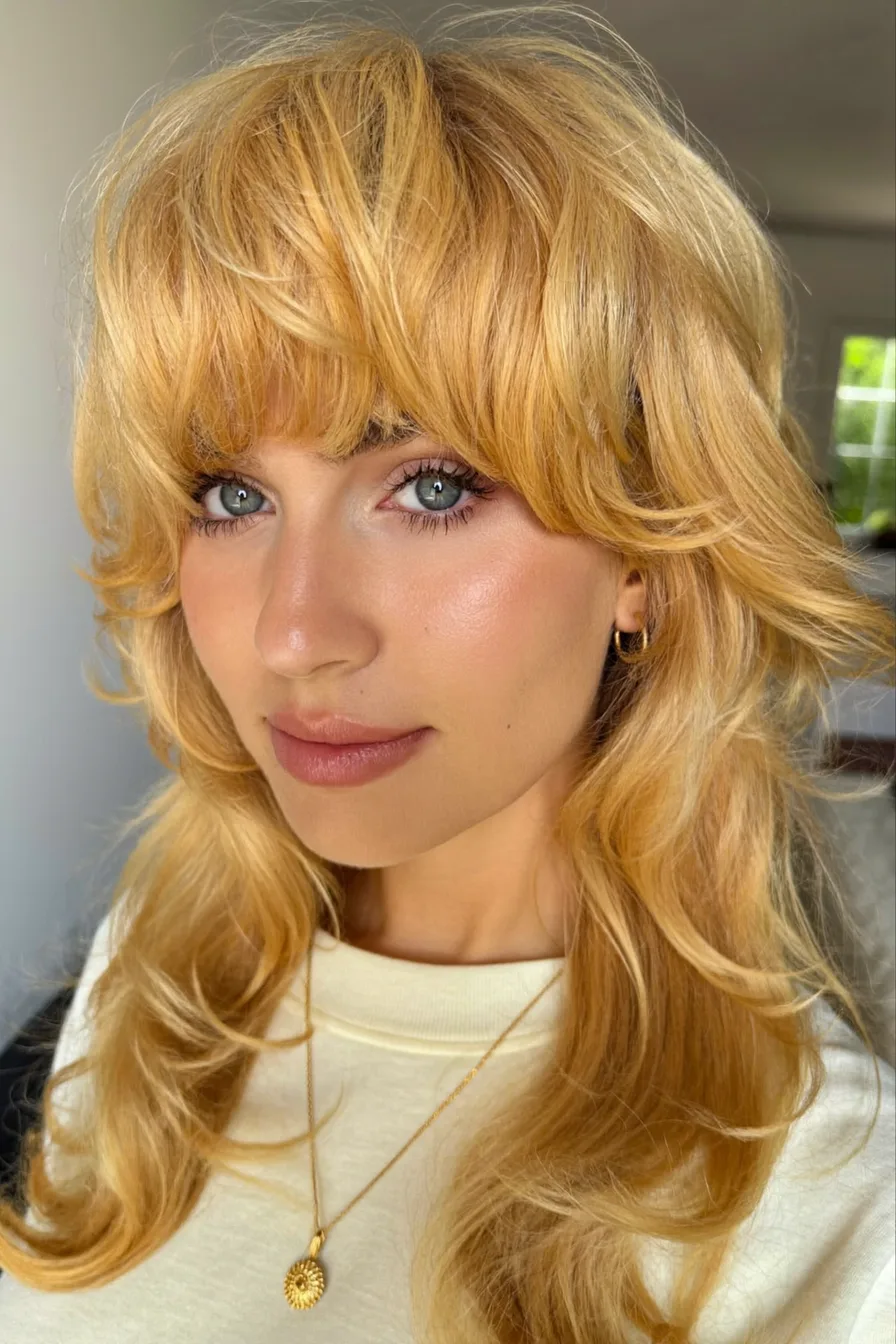 Long Layered Shag with Curtain Bangs and Voluminous Waves