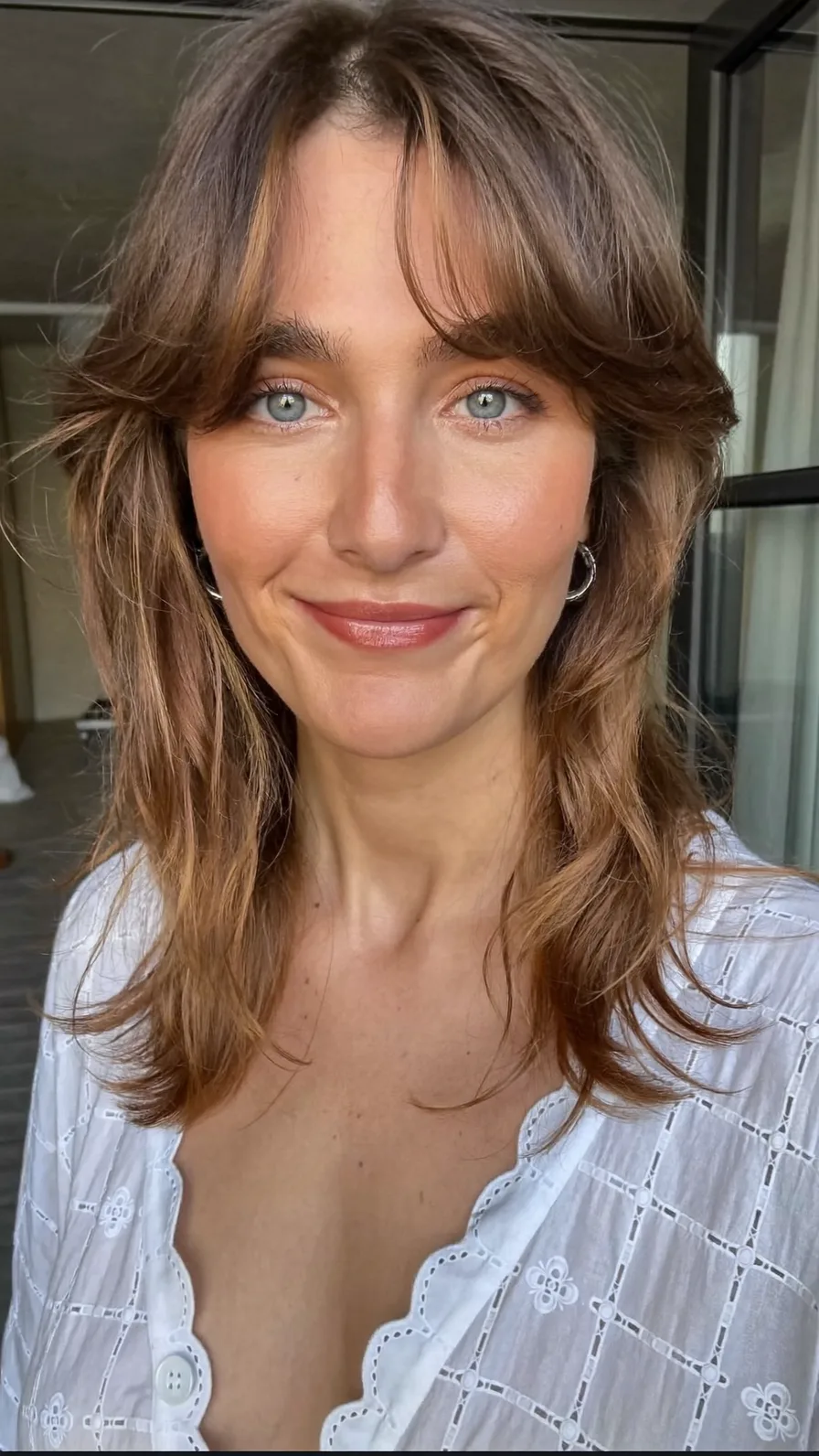 Modern Shag with Curtain Bangs and Subtle Balayage Highlights