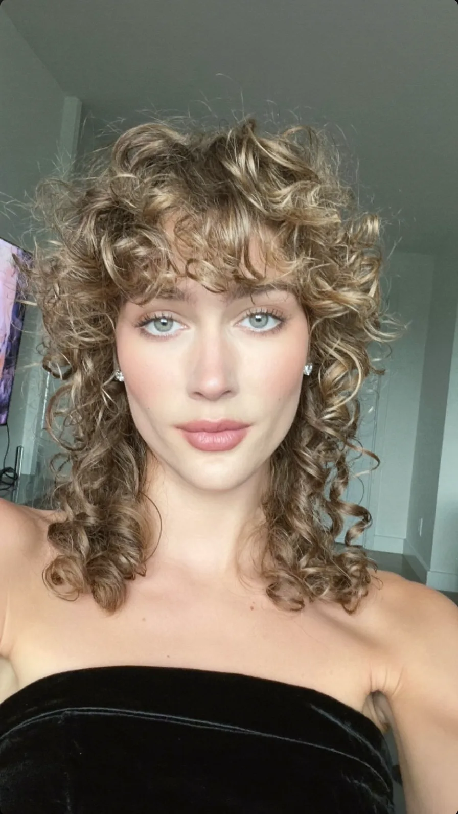 Voluminous Curly Shag with Curtain Bangs for Medium Length Hair