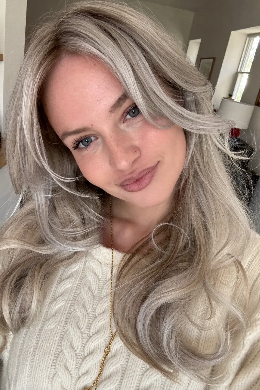 Effortless Ash Blonde Mid-Back Length Layered Hairstyle with Volume