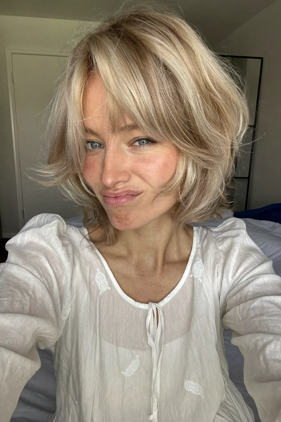 Choppy Layered Shag with Curtain Bangs for Cool Blonde Hair