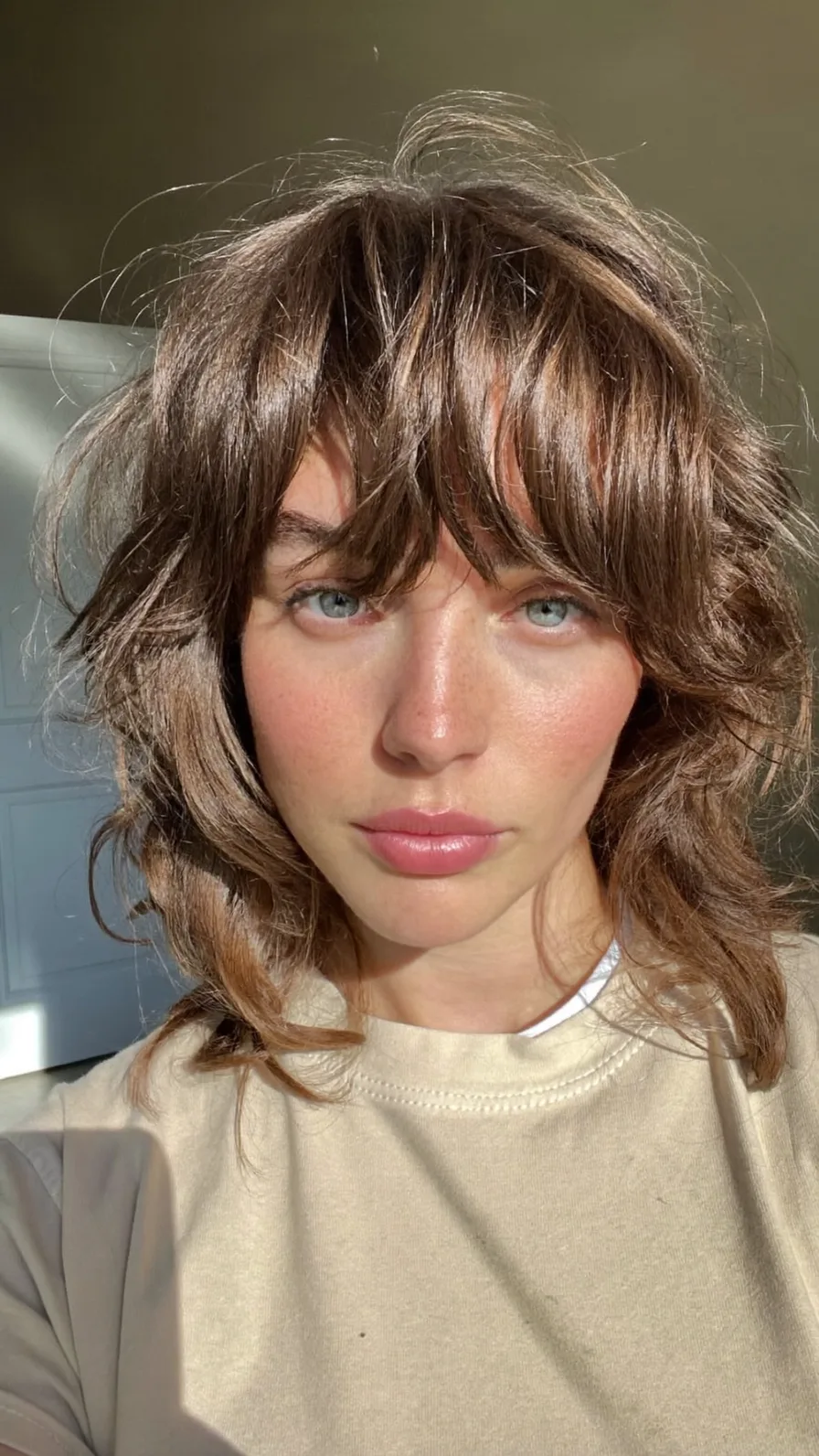 Textured Shoulder-Length Shag with Curtain Bangs and Volume