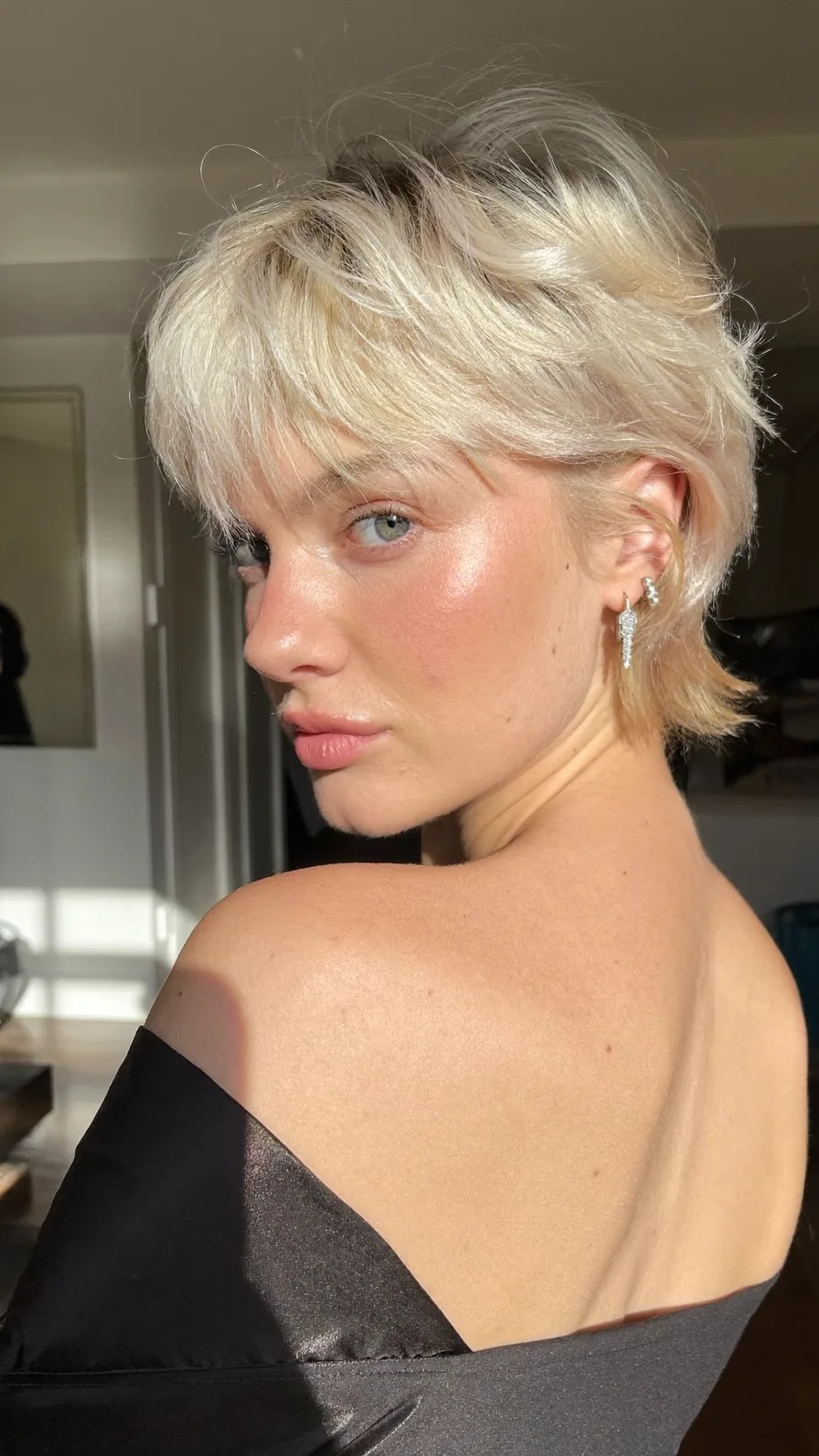 Modern Textured Platinum Blonde Shag with Wispy Bangs