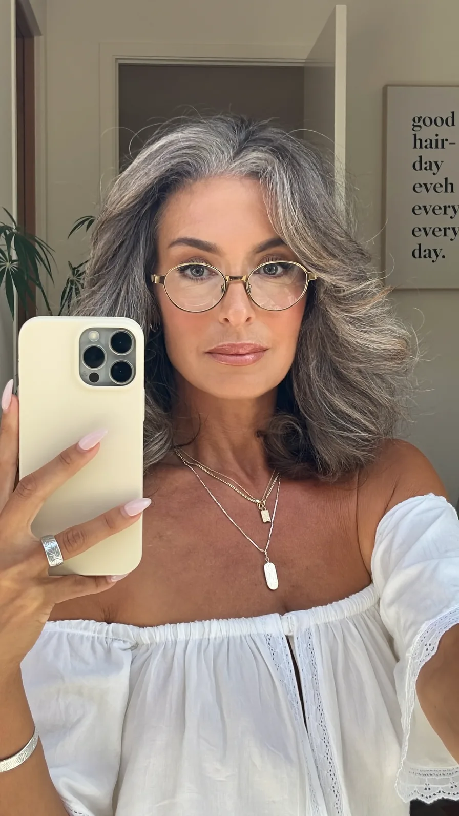 Elegant Voluminous Layered Shoulder-Length Gray Hair with Curtain Bangs