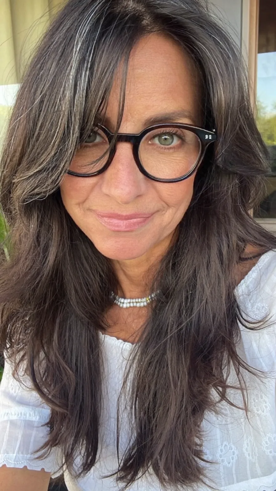 Long Textured Layers with Side-Swept Highlights for Mature Women