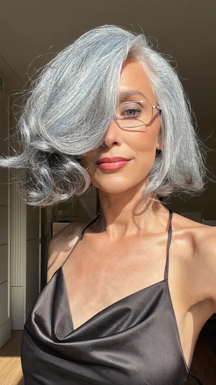 Voluminous Side-Swept Silver Gray Lob with Flicked Ends