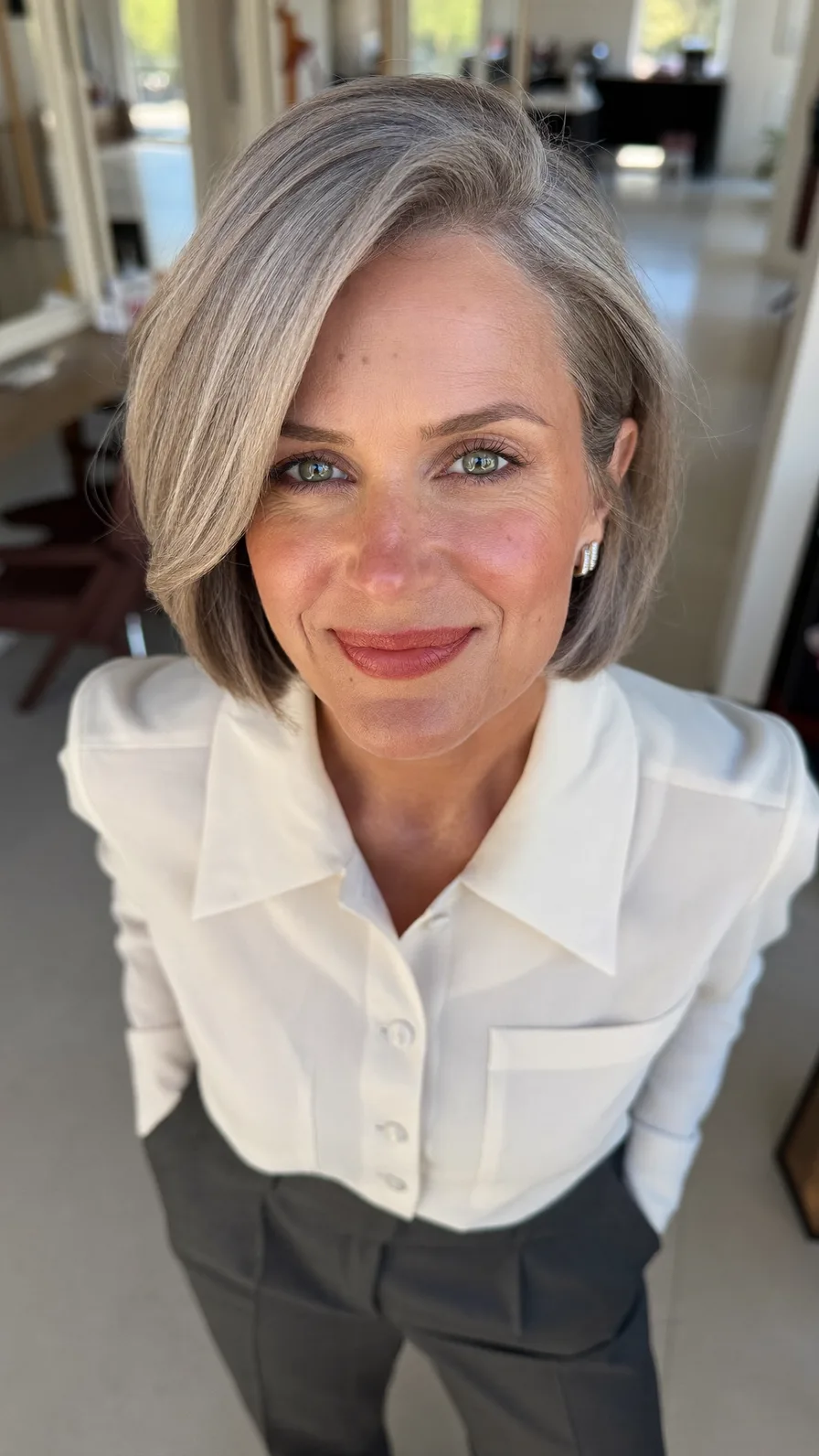 Elegant Chin-Length Bob with Side-Swept Layers for Mature Hair