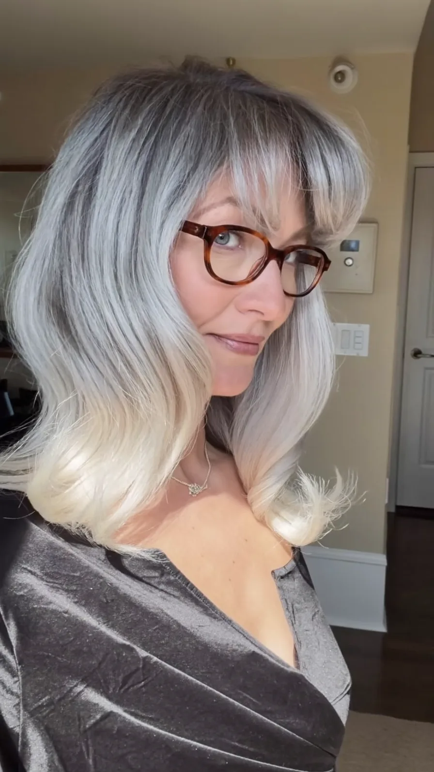 Classic Silver Shoulder-Length Hairstyle with Side-Swept Bangs