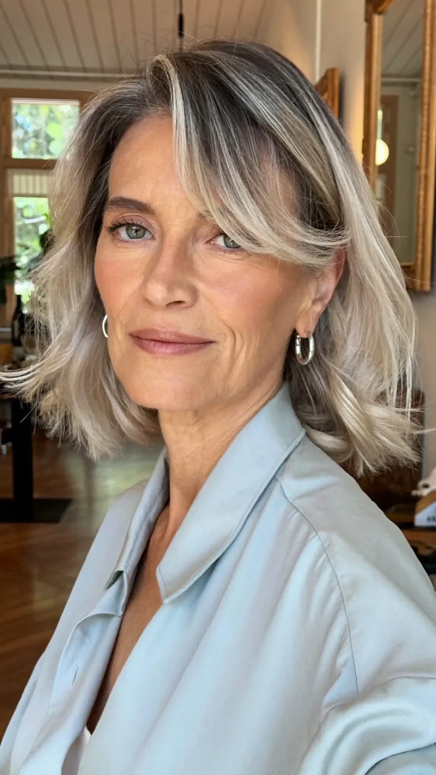 Elegant Silver Blonde Blunt Bob with Soft Curtain Bangs