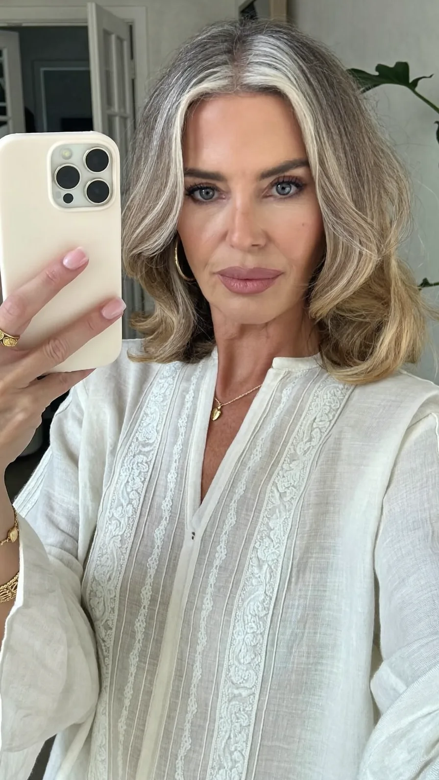 Elegant Medium Salt and Pepper Hair with Soft Curtain Bangs