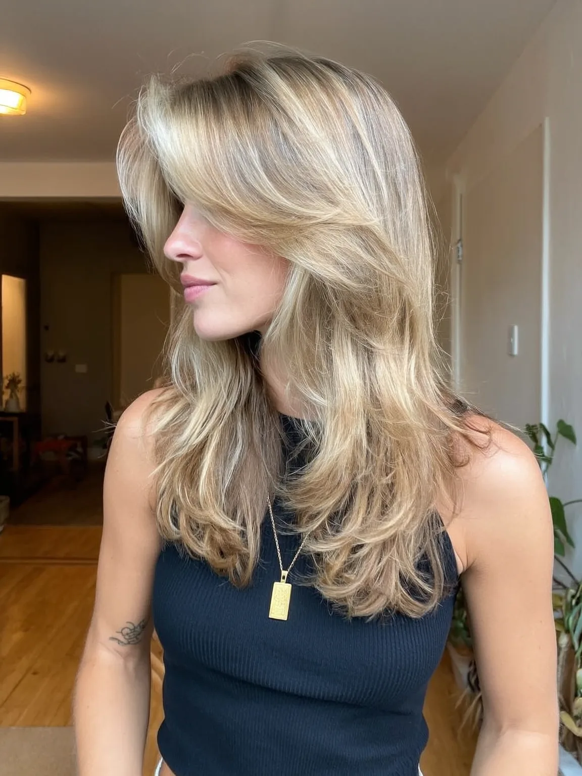 Voluminous Honey Blonde Balayage Long Layers with Curtain Bangs