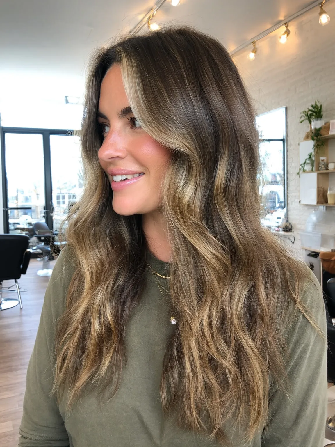 Long Honey Blonde Balayage Wavy Layers with Curtain Bangs