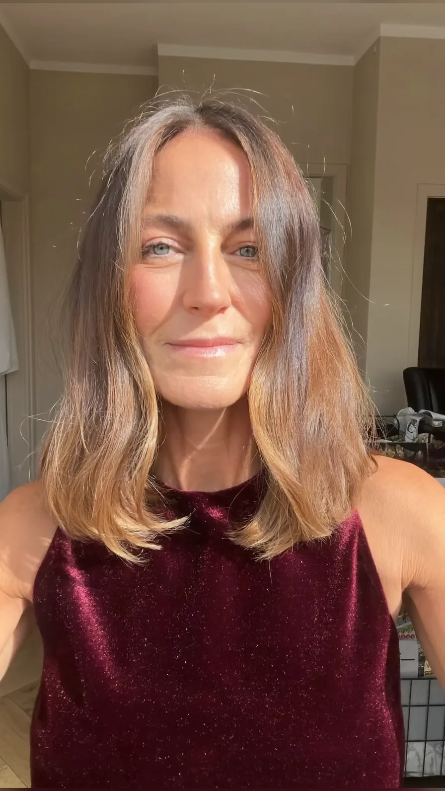Medium Length Wavy Layers with Subtle Caramel Balayage Highlights